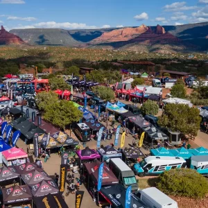 LARGE GATHERING OF BIKERS IN A VENDOR AREA