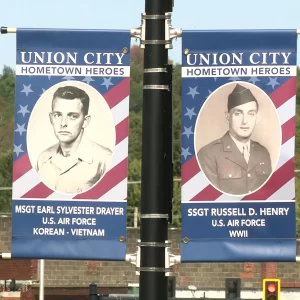 pole banners attached to a lightpole showing army veterans